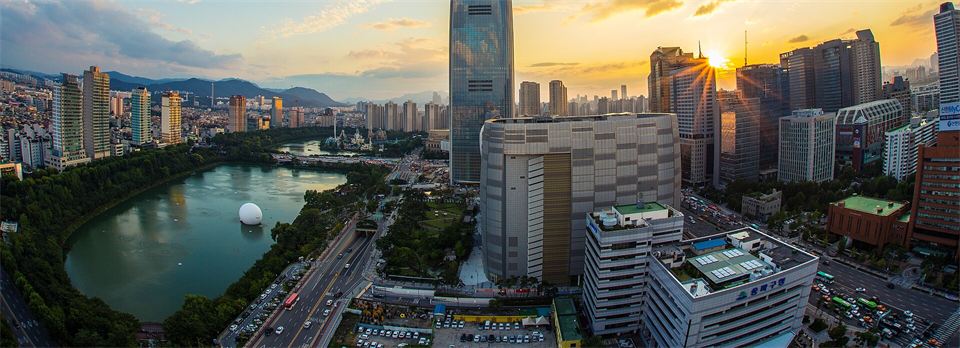 Seoul at sunset, with Lotte World Tower and Seokchon Lake