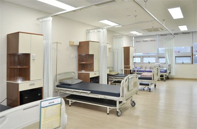 Inpatient ward with hospital beds at Gangnam JS Hospital