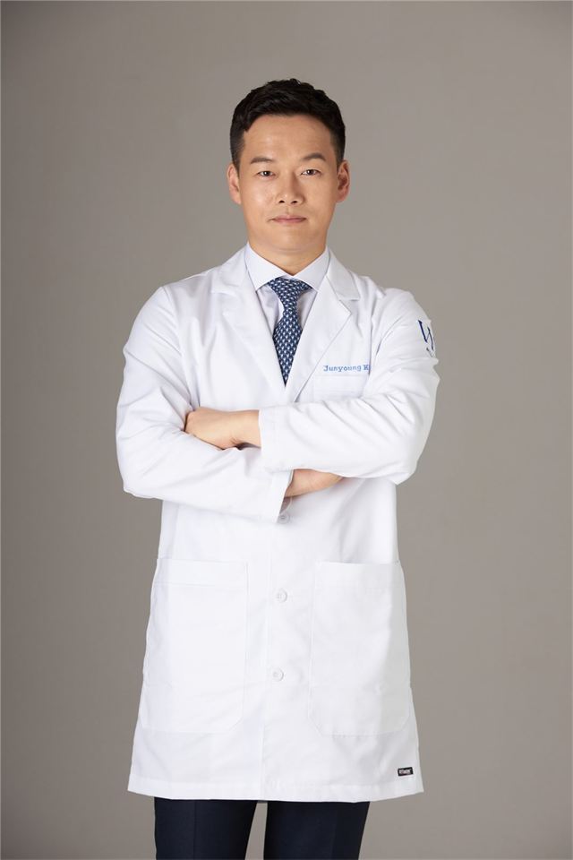 Portrait of Dr. Kim Jun-young in a white coat